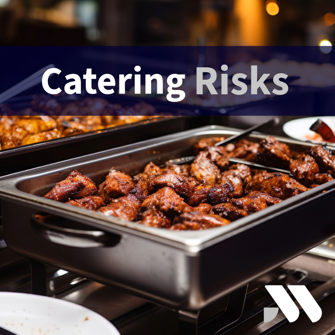 Professional catering staff preparing and serving food at a catered event, highlighting the insurance and risk management needs of catering businesses.