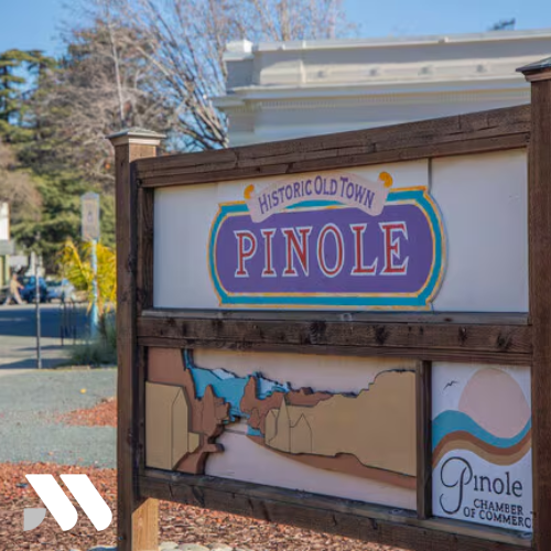Historic Old Town Pinole welcome sign featuring the Pinole Chamber of Commerce logo in downtown Pinole, California.