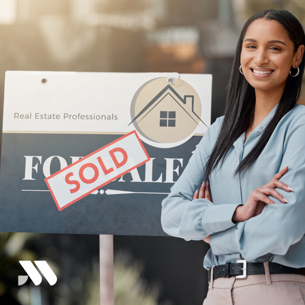 Real estate agent reviewing client contracts and insurance documents at a desk while preparing for property transactions and business risk management.